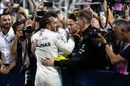 Race winner Lewis Hamilton celebrates in parc ferme with the team