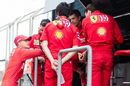 Mick Schumacher speaks to Ferrari team members