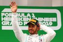 Race winner Lewis Hamilton celebrate on the podium