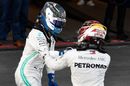 Race winner Valtteri Bottas and Lewis Hamilton celebrates in parc ferme