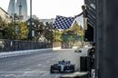 Race winner Valtteri Bottas takes the chequered flag