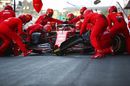 Charles Leclerc makes a pit stop for new tyres