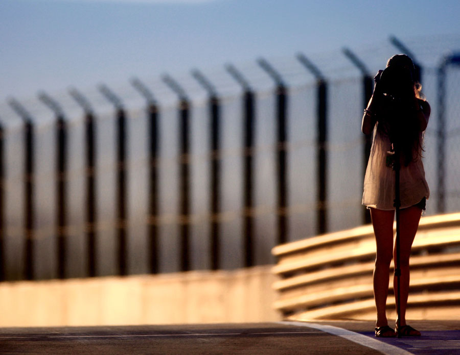 Jessica Michibata takes a photo down the Hungaroring pit lane