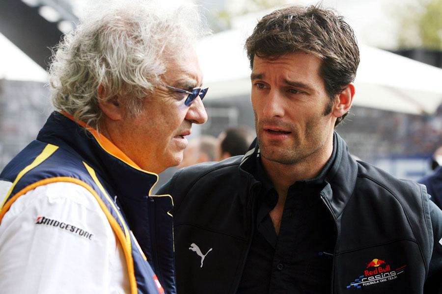 Mark Webber talks to his manager Flavio Briatore