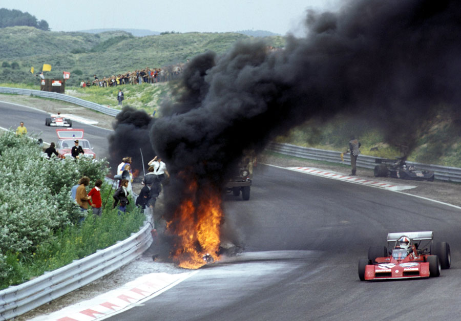 Chris Amon passes the March 731 of Roger Williamson following his crash on the eighth lap that would see him perish through asphyxiation, despite the efforts of David Purley