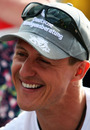 Michael Schumacher relaxes in the paddock