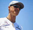 Michael Schumacher makes his way through the Valencia paddock