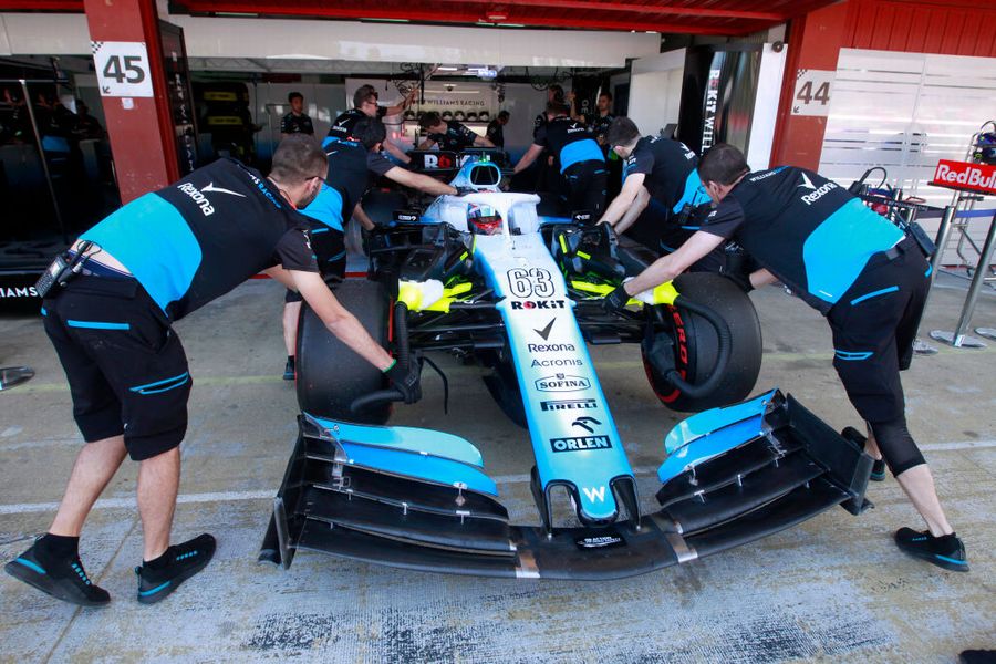 Williams mechanics wheel Robert Kubica back into the garage