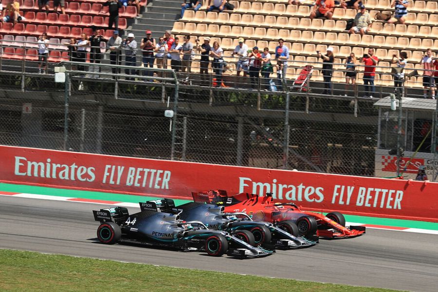 Lewis Hamilton,  Valtteri Bottas and Sebastian Vettel battle for position at the start of the race