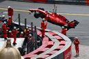 Sebastian Vettel walks from his car after crashing
