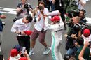 Race winner Lewis Hamilton celebrates with Toto Wolff