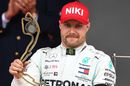 Valtteri Bottas on the podium with the trophy