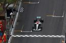 Race winner Lewis Hamilton crosses the finish line