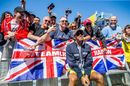 Lewis Hamilton poses for a photo with fans