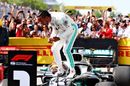 Race winner Lewis Hamilton celebrates in parc ferme