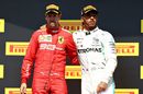 Race winner Lewis Hamilton and Sebastian Vettel hug on the podium