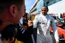 Race winner Lewis Hamilton cerebrates in parc ferme with the team