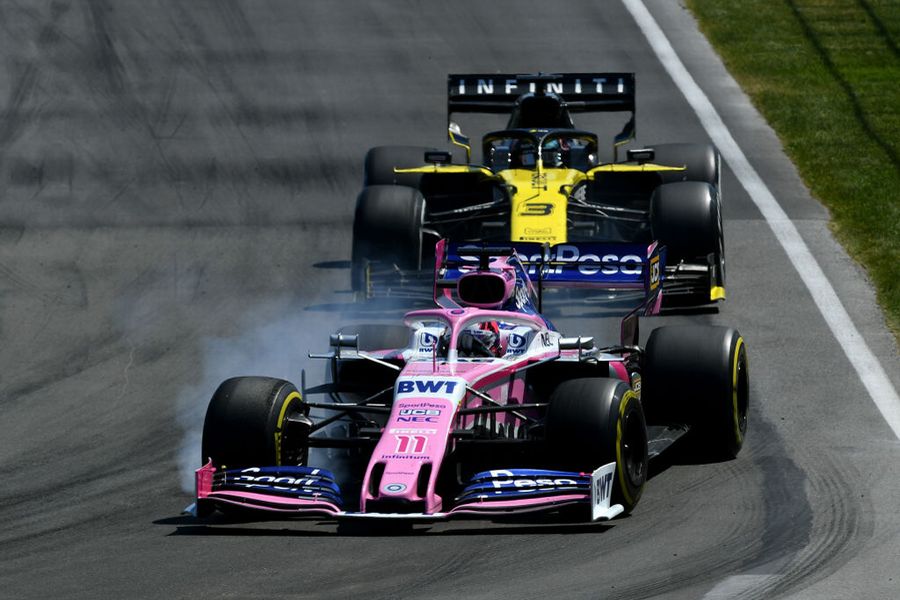 Sergio Perez locks a wheel under braking as he leads Daniel Ricciardo