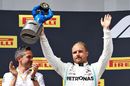 Valtteri Bottas celebrate on the podium with the trophy