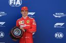 Charles Leclerc takes pole and holds his trophy