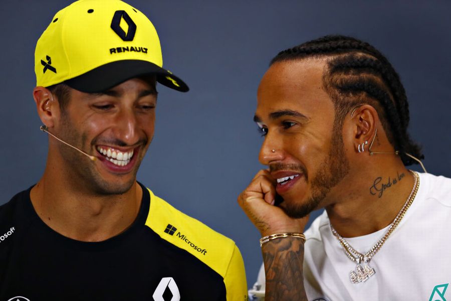 Daniel Ricciardo talks with Lewis Hamilton in the Press Conference