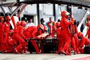 Sebastian Vettel makes a pitstop for a new front wing