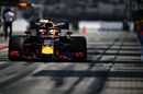 Max Verstappen powers down the pit lane in the Red Bull