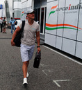 Michael Schumacher arrives in the paddock