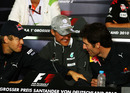 Michael Schumacher jokingly keeps team-mates Sebastian Vettel and Mark Webber apart