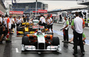 Adrian Sutil and Vitaly Petrov make practice pit stops