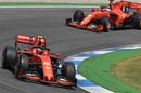 Charles Leclerc and Sebastian Vettel on track in the Ferrari