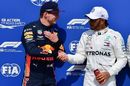 Pole sitter Lewis Hamilton shakes hands with Max Verstappen in parc ferme