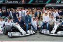 Lewis Hamilton, Valterri Bottas and Toto Wolff pose with the team in costume