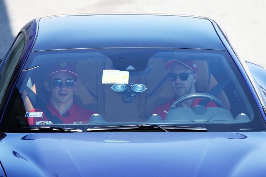 Sebastian Vettel and Charles Leclerc arrive in the Paddock