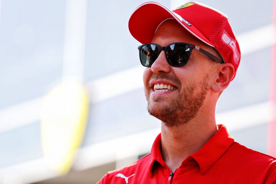Sebastian Vettel looks relaxed in the paddock