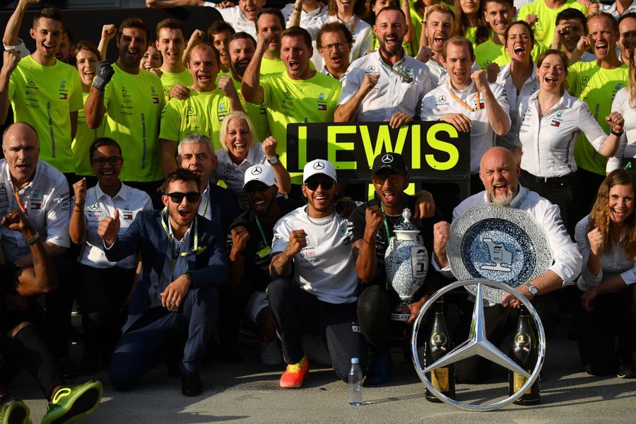 Race winner Lewis Hamilton celebrates with his team
