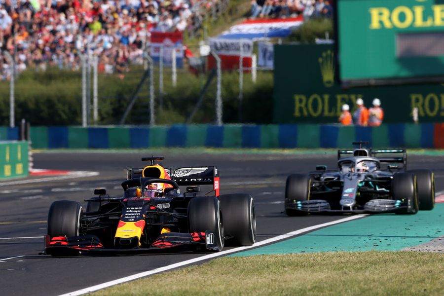 Max Verstappen and Lewis Hamilton battle for position