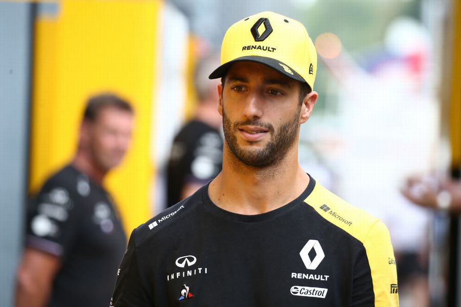 Daniel Ricciardo walks in the Paddock