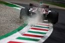 Kimi Raikkonen runs wide in the Alfa Romeo