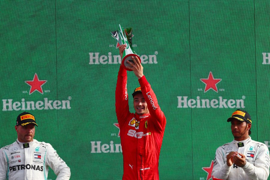 Race winner Charles Leclerc celebrate on the podium with the trophy