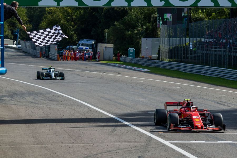 Race winner Charles Leclerc crosses the line to take the chequered flag