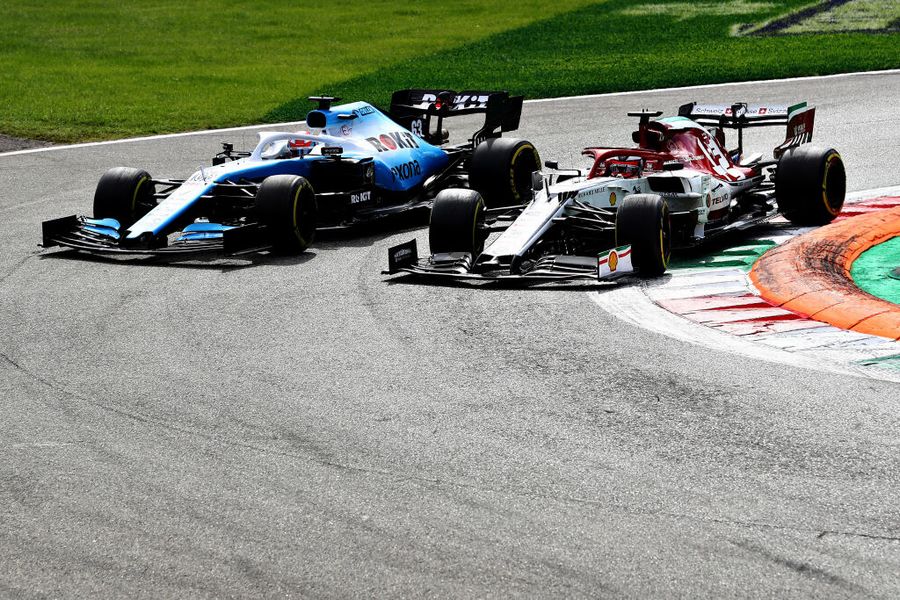 Kimi Raikkonen and George Russell battle for position