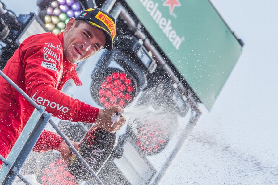 Race winner Charles Leclerc celebrate on the podium with the champagne