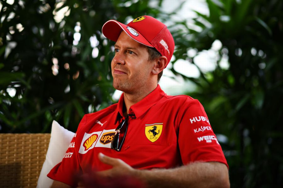 Sebastian Vettel talks to the media