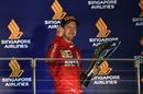 Race winner Sebastian Vettel celebrate on the podium with the trophy