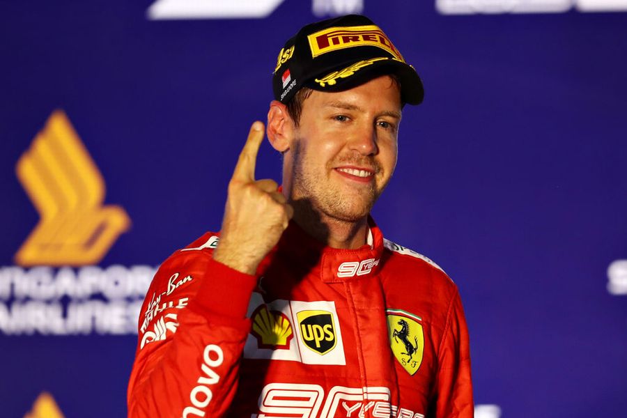 Race winner Sebastian Vettel celebrate on the podium