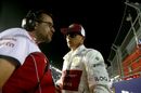 Kimi Raikkonen talks with his engineer
