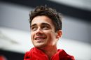 Charles Leclerc looks relaxed in the paddock