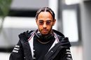 Lewis Hamilton walks in the Paddock