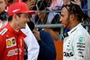 Pole sitter Charles Leclerc talks with Lewis Hamilton in parc ferme